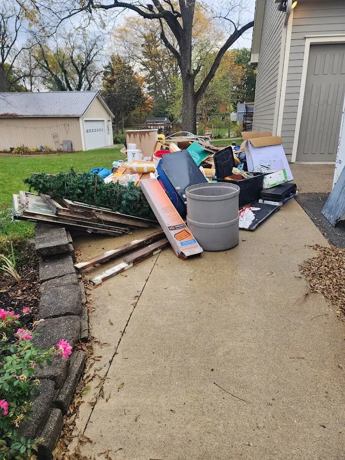 Dumpster being loaded with debris for Commercial Dumpster Rental in South Highpoint